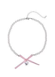 Collar de corazón de plata con lazo rosa de Nanako