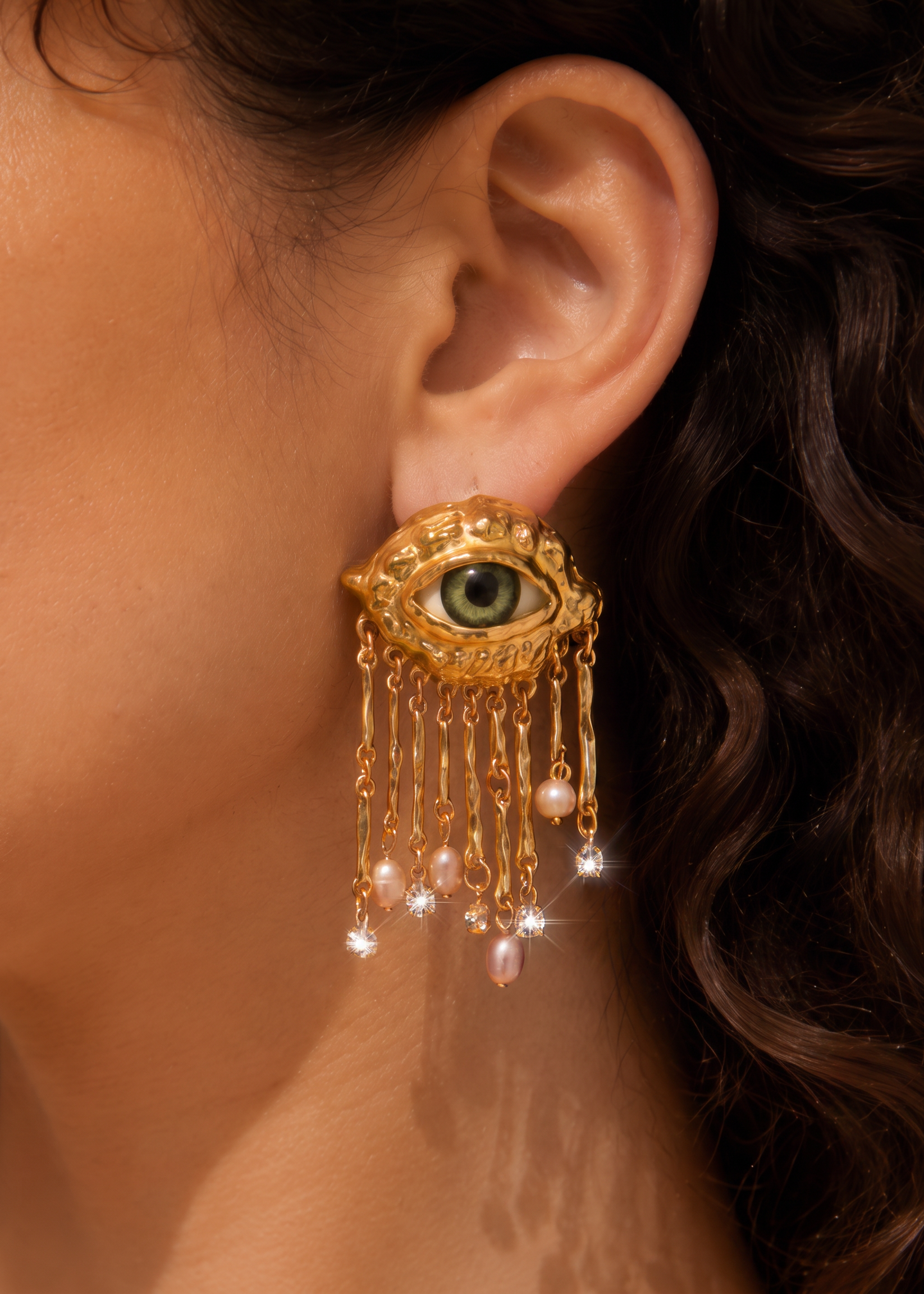 crying-out-pearls-golden-eyes-earrings.png